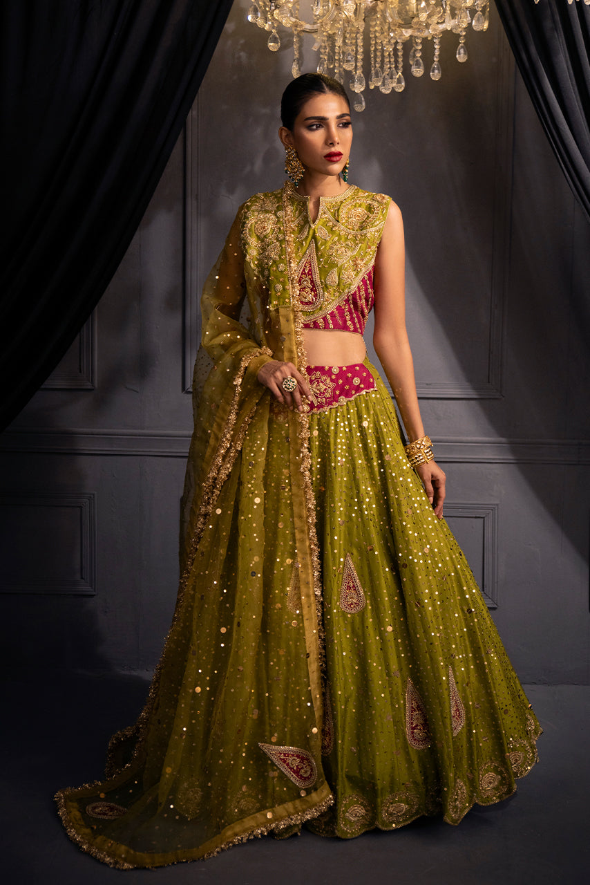 The Zohra olive-gold bridal lehenga features a hand-embellished raw silk choli, embroidered paisley motifs, shimmering sequins, and an ethereal organza dupatta.