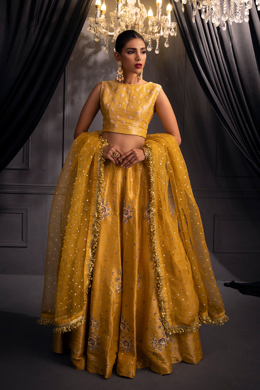 Zarmina designer bridal ensemble in gold mustard with embroidered lehenga, embellished choli and dupatta
