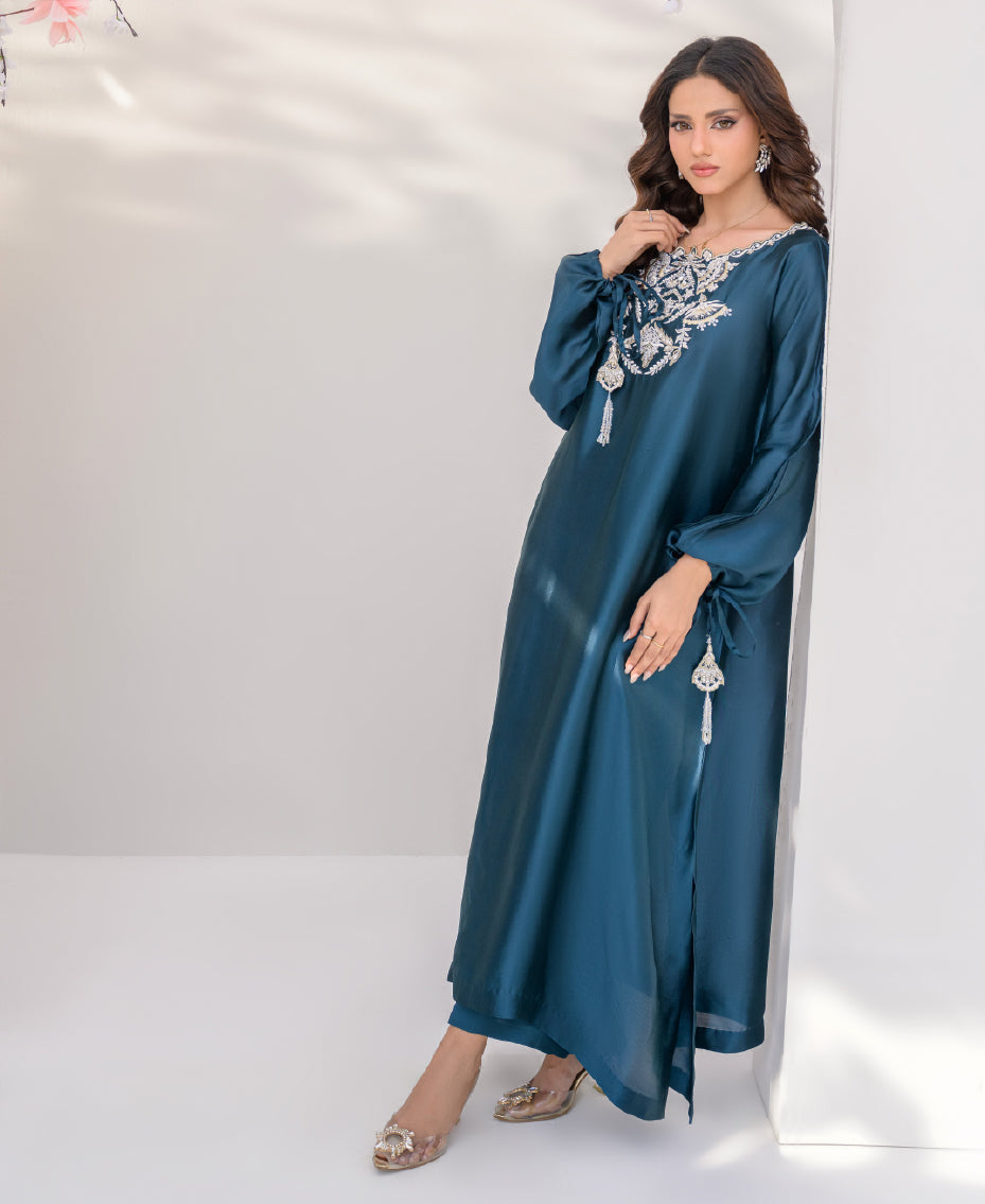 A teal dress with intricate silver embroidery with tassel for women